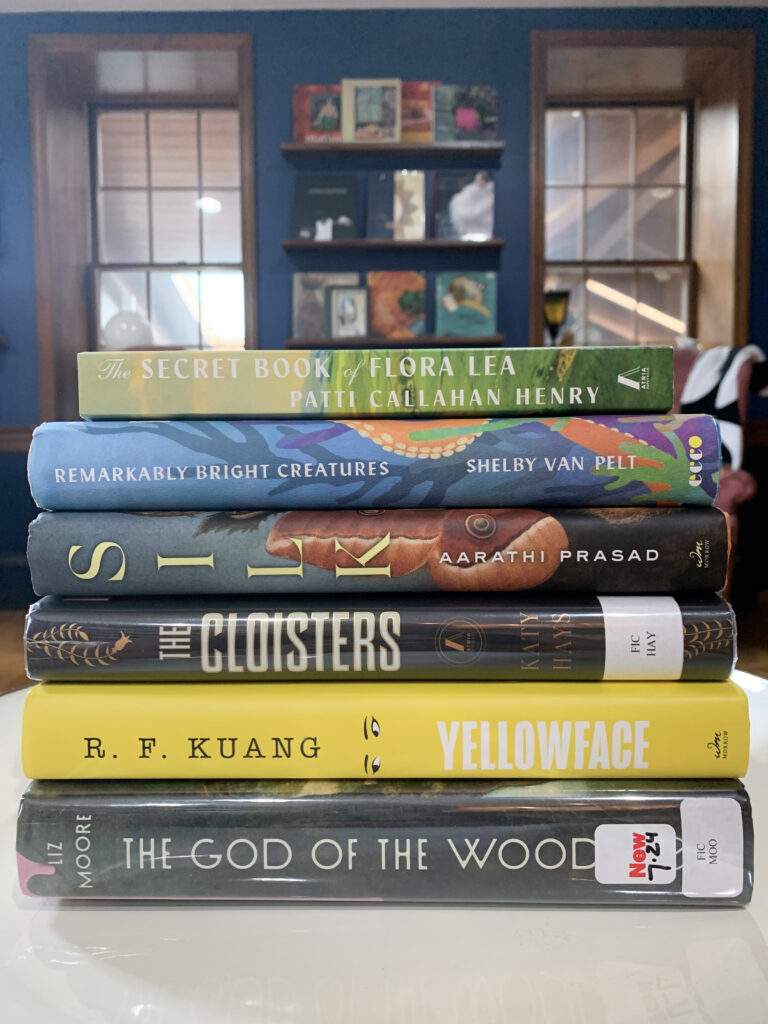 july book roundup - reviews of god of the woods, yellowface, the cloisters, remarkably bright creatures